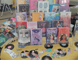 A shelf of books and stationery items